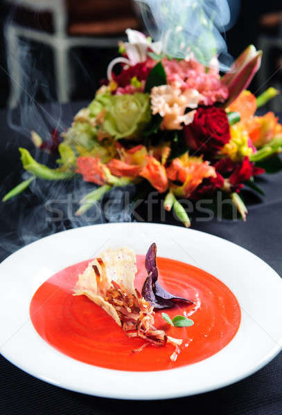 Tomato soup garnished with ham and herbs with alder smoke Stock photo © amok