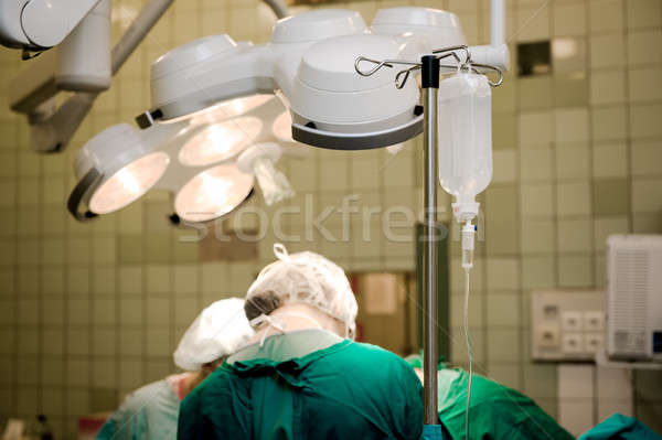 Team of surgeons at work in operating room Stock photo © amok