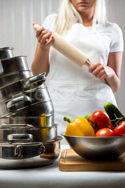 Stock photo: Raw vegetables with kitchen utensil and woman holding rolling-pin