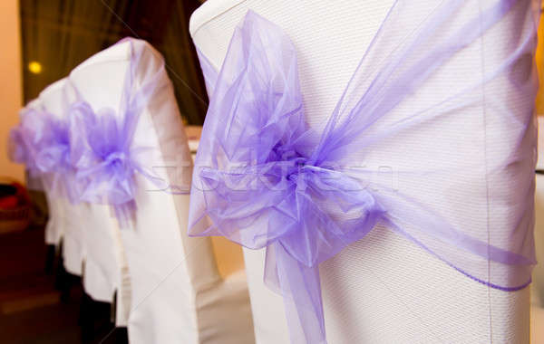 White wedding chairs decorated with purple bows Stock photo © amok