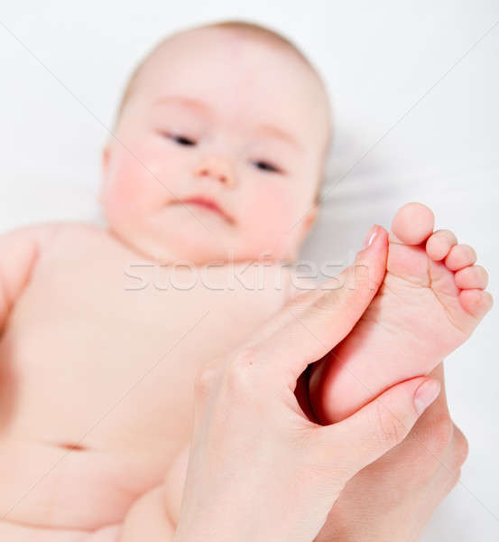 Mother massaging her baby girl Stock photo © amok