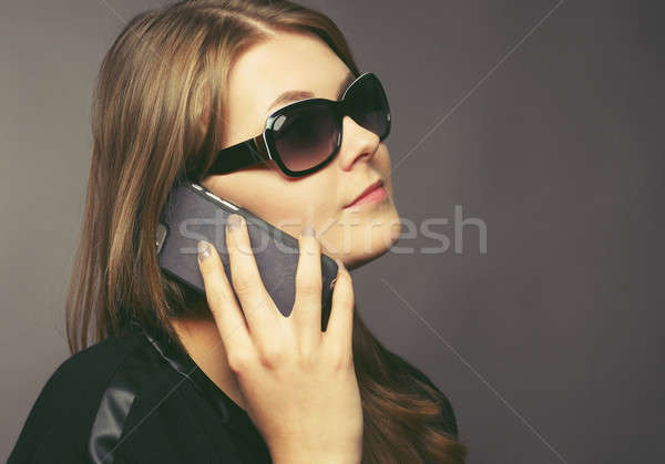 Young woman with a mobile phone Stock photo © andreasberheide
