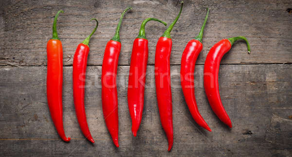 Red chilies on wood Stock photo © andreasberheide
