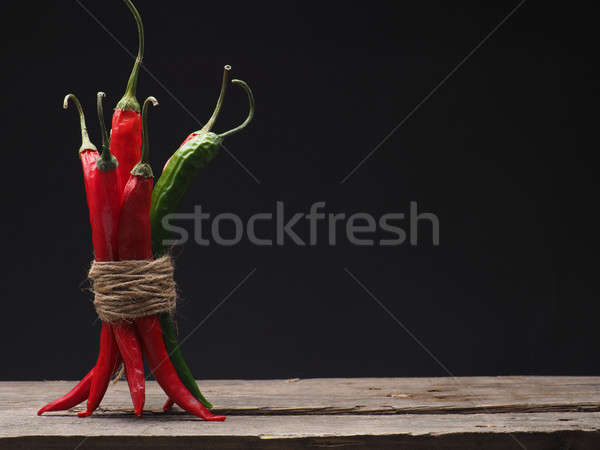 Delicious chilies on a wooden table Stock photo © andreasberheide
