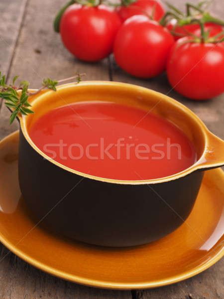 Gazpacho in a rustic bowl on a wooden table Stock photo © andreasberheide