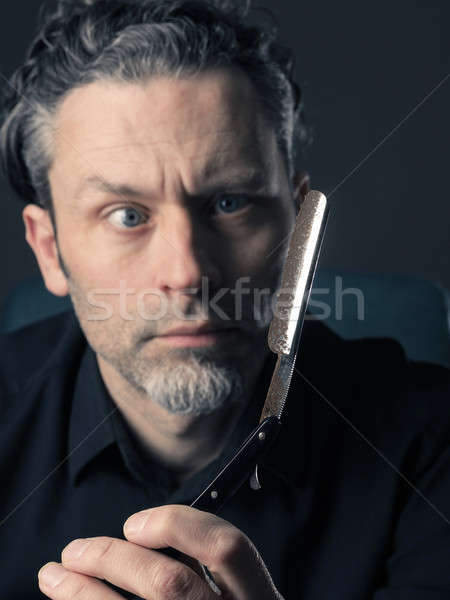 Man with shaving knife Stock photo © andreasberheide