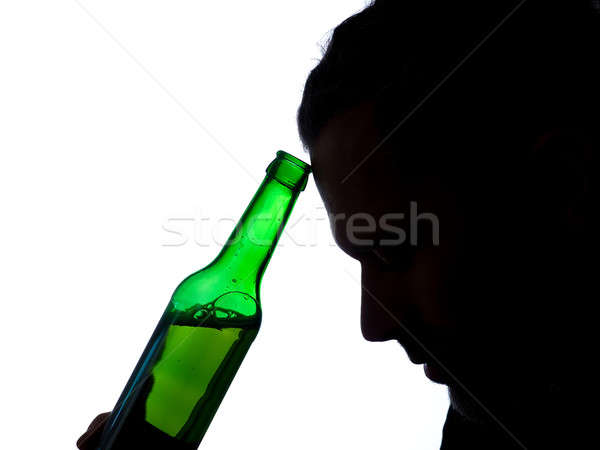 Man with a beer bottle Stock photo © andreasberheide