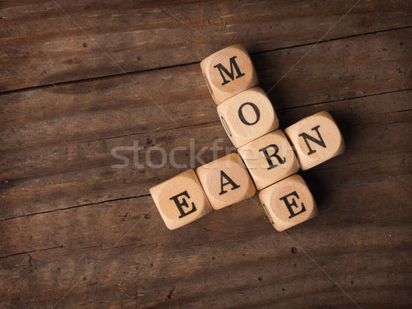 Earn more on wooden dices Stock photo © andreasberheide
