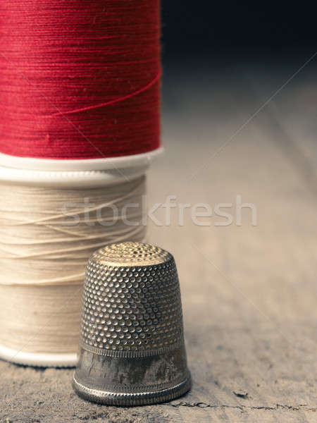 Old thimble and yarn Stock photo © andreasberheide
