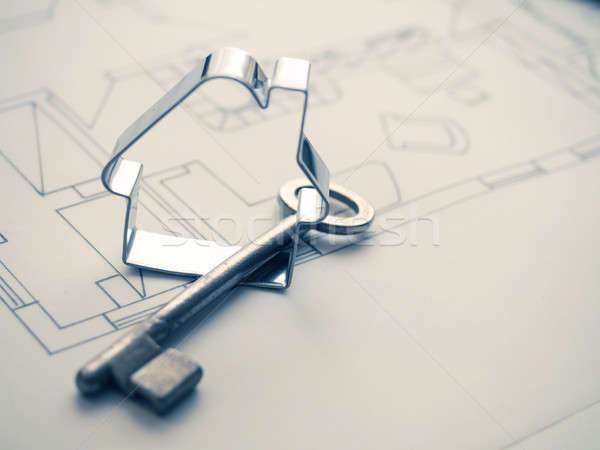 House shape with a key on construction plan Stock photo © andreasberheide