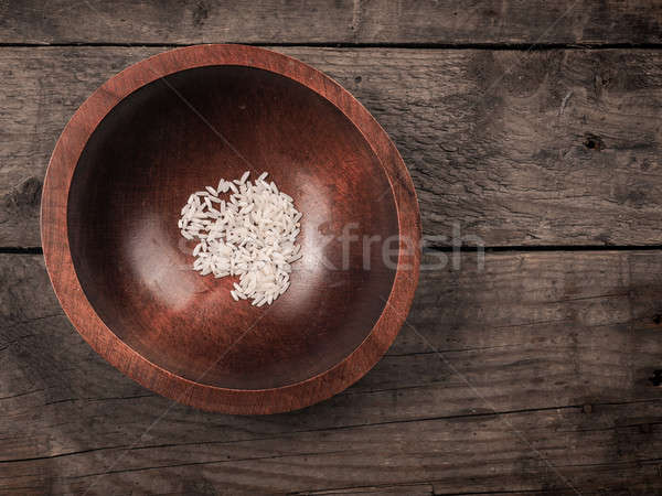 Rice in a wooden bowl Stock photo © andreasberheide