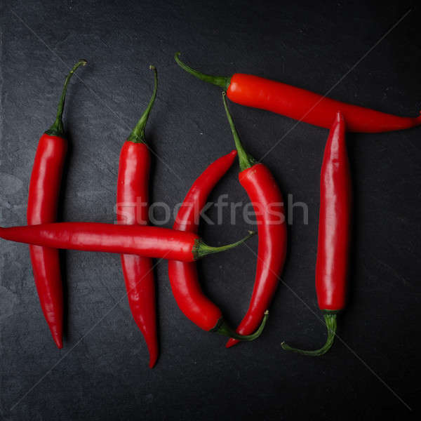 Hot chilies on slate Stock photo © andreasberheide