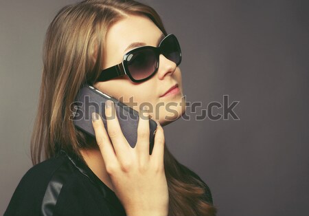 Young woman with a mobile phone Stock photo © andreasberheide