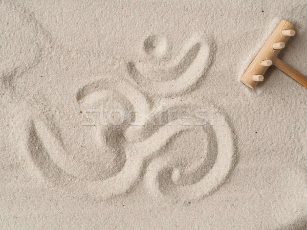 Om symbol in sand Stock photo © andreasberheide