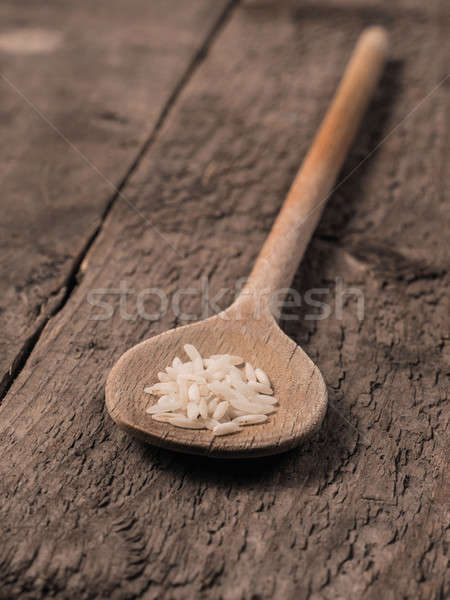 Rice on a wooden spoon Stock photo © andreasberheide