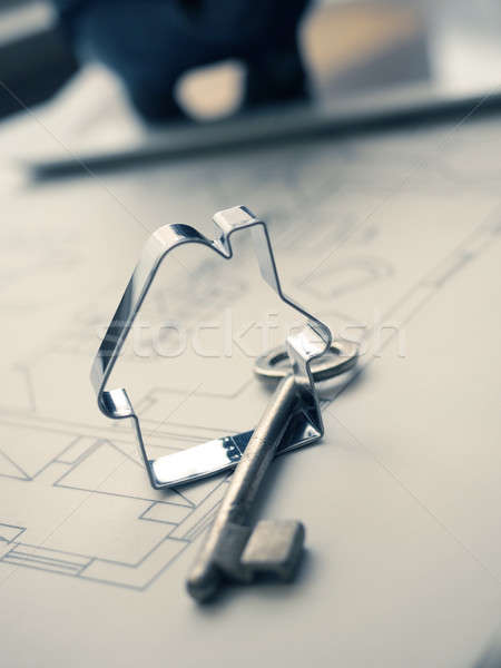 House shape with a key on construction plan Stock photo © andreasberheide
