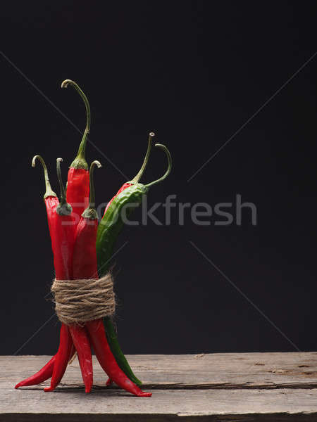 Delicious chilies on a wooden table Stock photo © andreasberheide