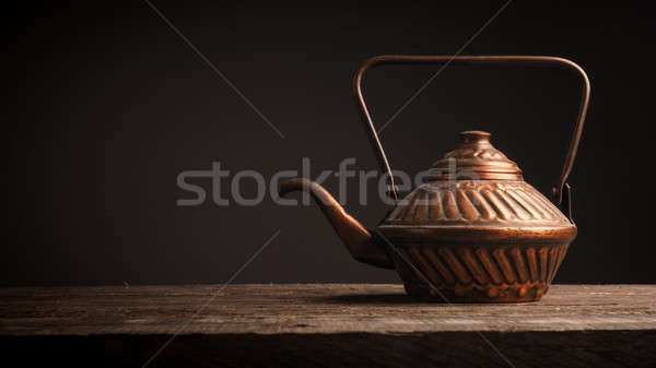 Old used copper tea pot Stock photo © andreasberheide