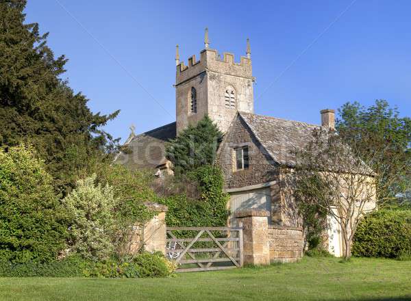 Cotswold church and cottage Stock photo © andrewroland