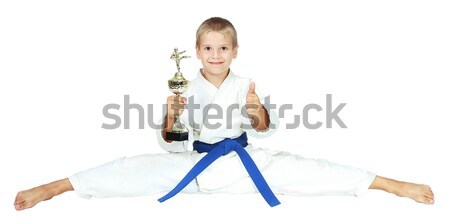Boy in a kimono sits on a twine with the award at the hands of isolated Stock photo © Andreyfire
