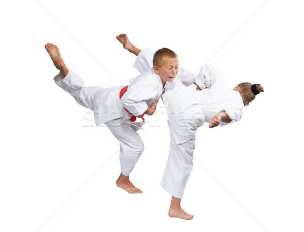 Children in karategi are beating karate blows Stock photo © Andreyfire