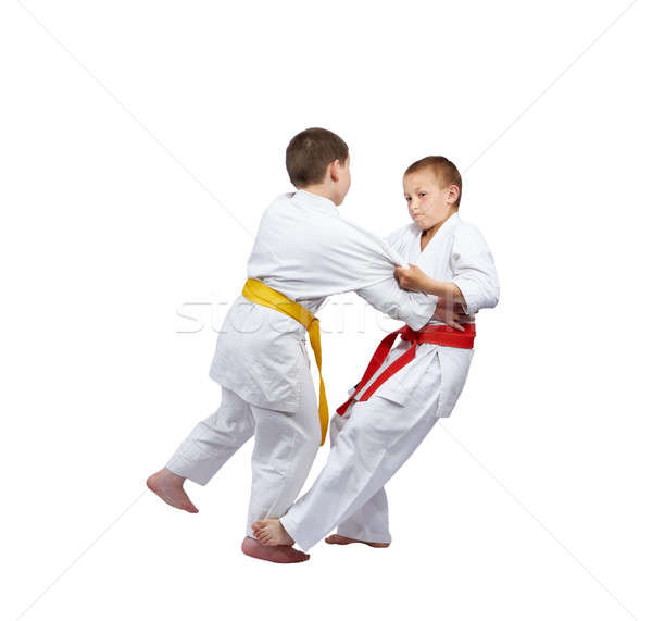 Slicing down under foot makes an athlete with a red belt Stock photo © Andreyfire
