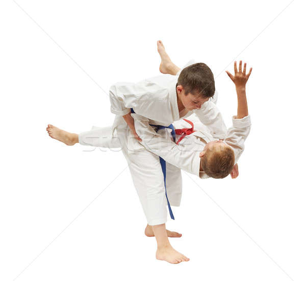 Children on a white background are doing throws Stock photo © Andreyfire