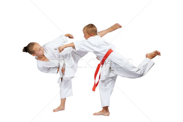 Children in karategi beat karate blows Stock photo © Andreyfire