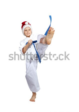 Mały sportowiec cap Święty mikołaj kopać nogi Zdjęcia stock © Andreyfire