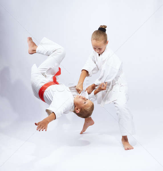 The girl in judogi throws the boy Stock photo © Andreyfire