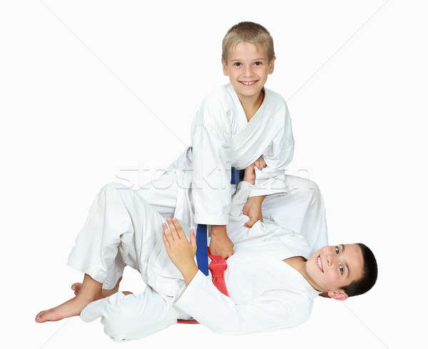On a white background sportsmens boys are doing throws isolated Stock photo © Andreyfire