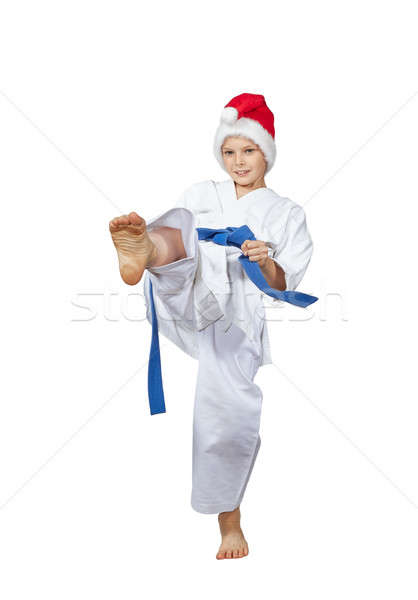Sportsman in a Santa Claus cap beats kicking Stock photo © Andreyfire