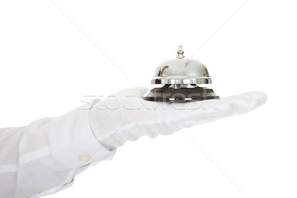 Waiter Holding A Service Bell In Hand Stock photo © AndreyPopov