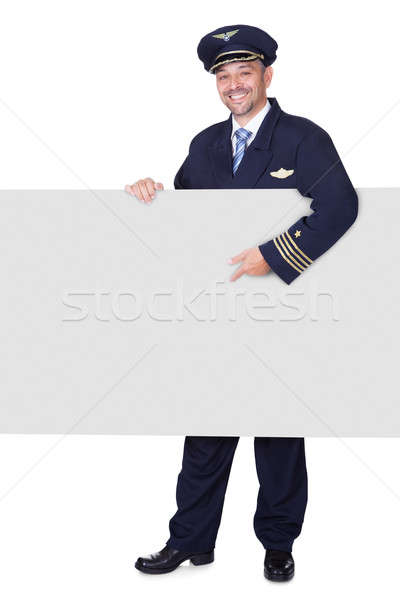 Portrait Of Happy Pilot Holding Blank Placard Stock photo © AndreyPopov