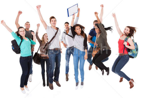 Successful University Students Over White Background Stock photo © AndreyPopov