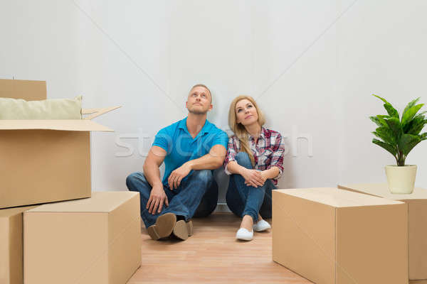 Young Couple In New House Looking Up Stock photo © AndreyPopov