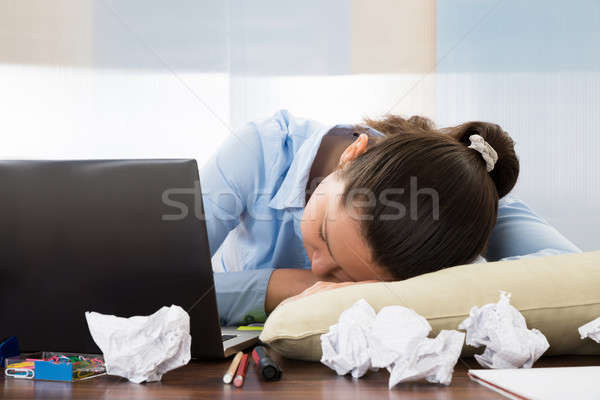 Businesswoman Sleeping At Desk Stock Photo C Andriy Popov