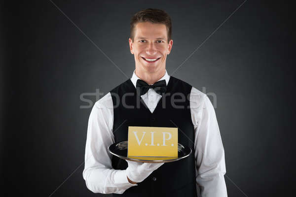 Waiter Showing Vip Sign Stock photo © AndreyPopov