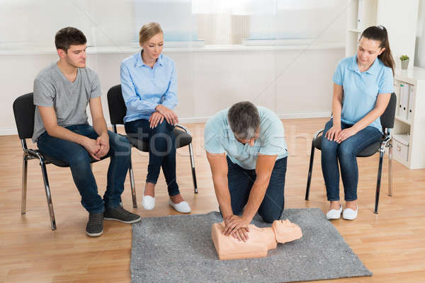 Stock photo: Instructor Teaching First Aid Cpr Technique