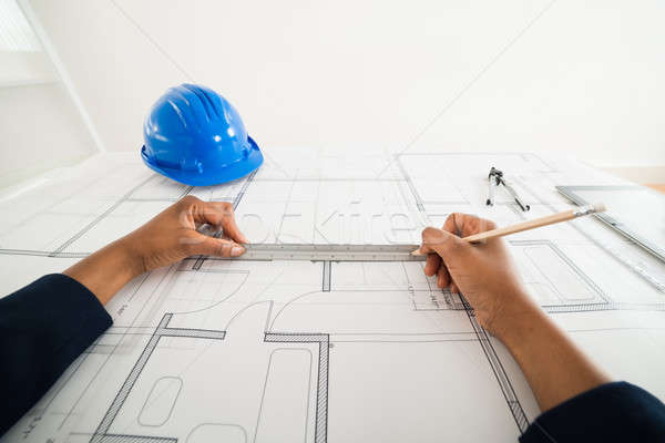 Person's Hand Using Pencil To Draw Blueprint Stock photo © AndreyPopov