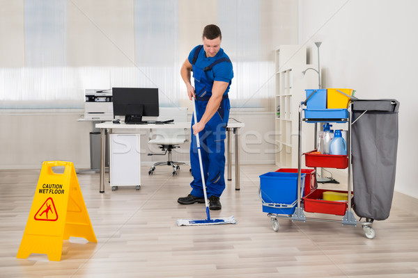 Janitor Mopping Floor In Office Stock photo © AndreyPopov