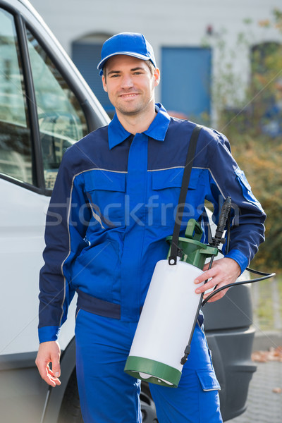 Pest Control Worker With Pesticide Against Truck Stock photo © AndreyPopov