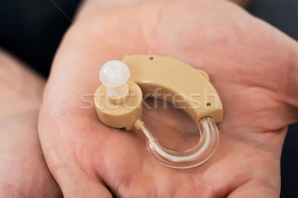 Aparat słuchowy dłoni człowiek medycznych Zdjęcia stock © AndreyPopov