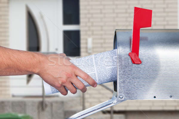 Person Hand Removing Newspaper From Mailbox Stock photo © AndreyPopov