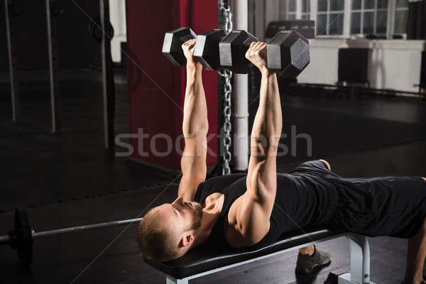 Stock photo: Man Exercising With Dumbbell