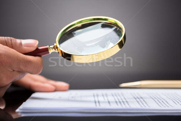 Judge Looking At Document With Magnifying Glass Stock photo © AndreyPopov