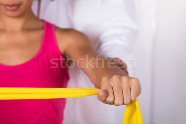 Woman Exercising With Exercise Band Stock photo © AndreyPopov