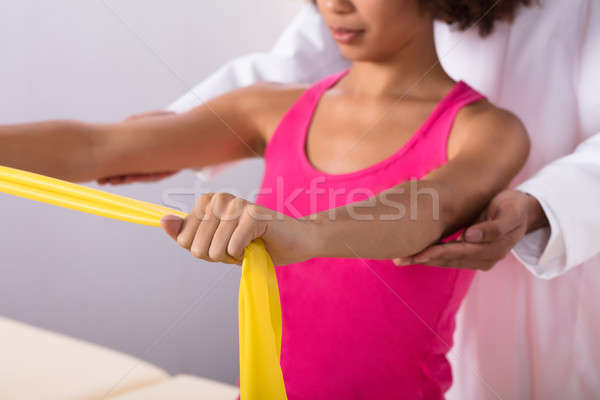 Woman Exercising With Exercise Band Stock photo © AndreyPopov