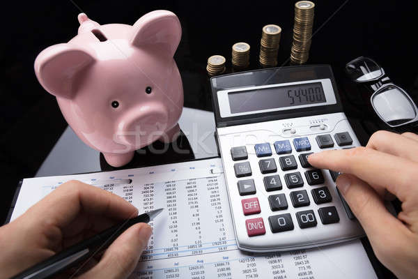 Businessperson Calculating Financial Data With Calculator Stock photo © AndreyPopov