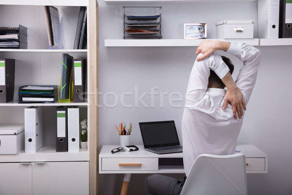 Businessman Stretching His Arms Stock photo © AndreyPopov
